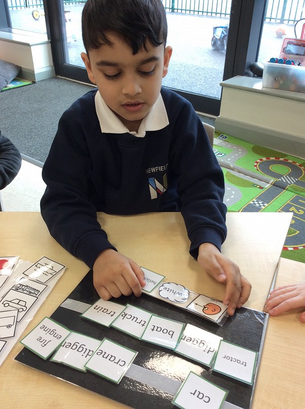 Pupil working with cards
